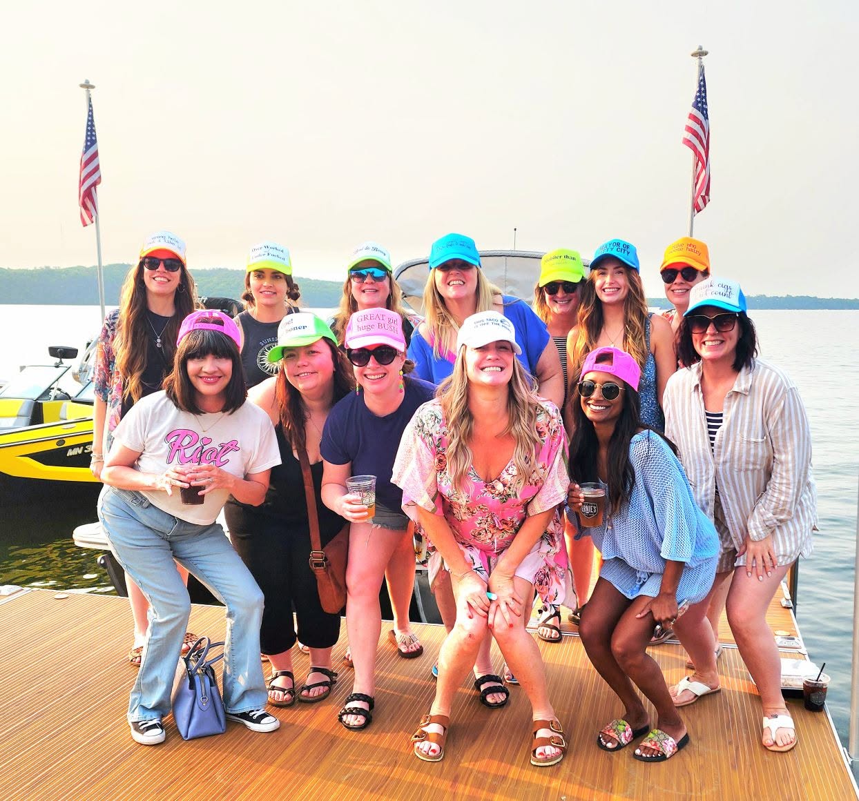 A bachelorette party group in their matching embroidered hats, done by Aspen Woods & Co.