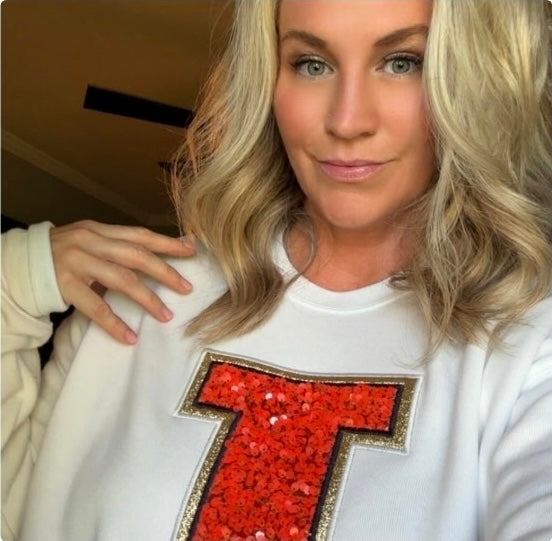 customer shares her custom sweatshirt apparel from aspen woods, thrilled with quality and design